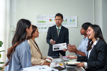 Business groups meeting in Asia and discussing new startup idea projects. Business team planning Strategic analysis presentation and brainstorming with reports in the office.