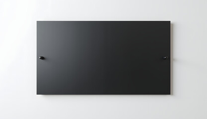 Empty black board mounted on light wall with smooth surface for message displaying concepts