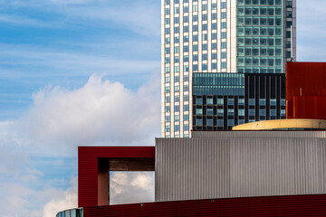 A vibrant blend of modern architectural elements with geometric lines and colors, set against a clear, serene sky, reflecting creative urban design concepts in Rotterdam Netherlands