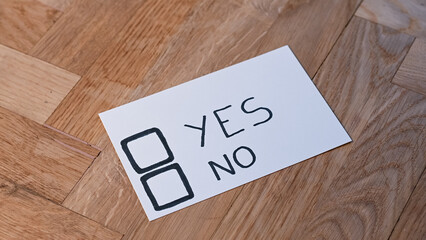 Blank voting card ready for person to cat vote yes or no, for or against. Public opinion votes an idea or notion to decide the outcome for the subject