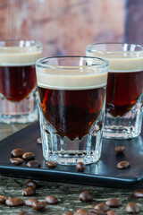 St. Patrickâ€™s Day cocktail of layered Irish cream and coffee liqueur made to look like mini stout shot