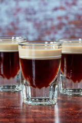 St. Patrick’s Day cocktail of layered Irish cream and coffee liqueur made to look like mini stout shot