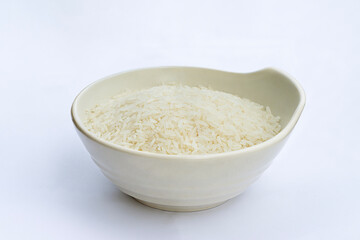 Asian short grain rice in white bowl . Uncooked rice or raw rice. Thai - Vietnam rice in white bowl isolated on white background.
