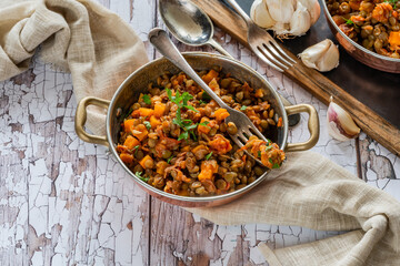 Brown lentils stew with white wine, serrano ham and smoked paprika