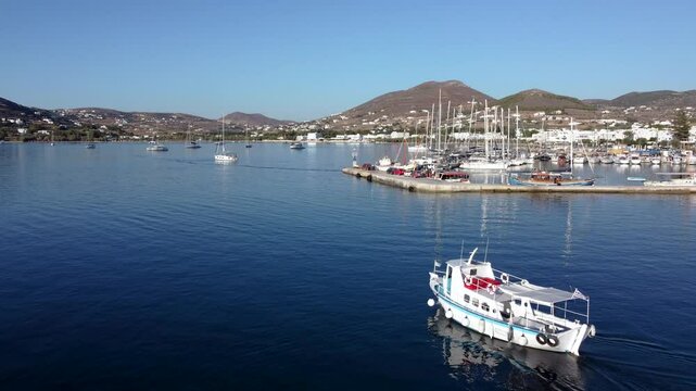 Aerial over Touristic Tour Boat Leaving Parikia Port, Greece