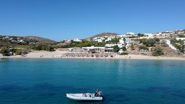 Panoramic Aerial Orbit View over Krios and Marcello Beach and an Pleasure Anchored Boat, Greece