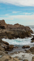 waves hitting rocks, indonesia beach