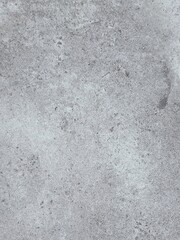 A grey and white wall with a few spots of color