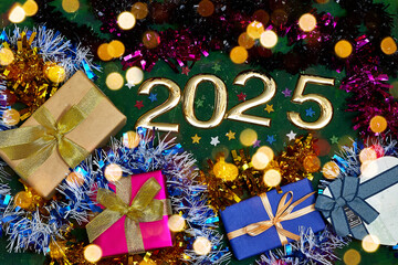 golden  numbers 2025 two thousand twenty five new year with tinsels and gift box 