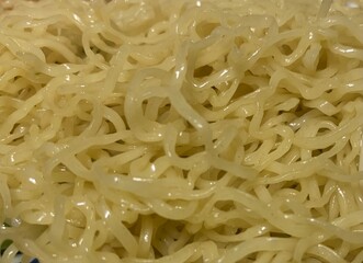 Plain cooked noodle as food background ingredient prepared for quick dish
