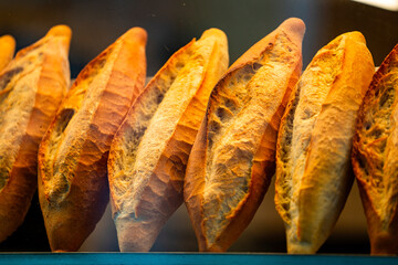 Turkish loaf of bread. Freshly baked Turkish bread seen through the oven window. Crispy fresh bread.