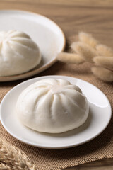 Asian steamed bun stuffed with pork and egg