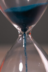 hourglass on a black background with a sand