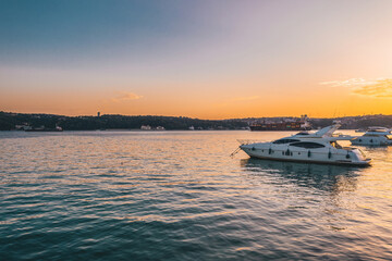 View of boats and ships on the Bosphorus among the unique sunset colors. Sea traffic. Unique view of Istanbul. Bosphorus. Turkey.