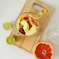 Jug of Tasty Citrus Tea with Lime and Apples
