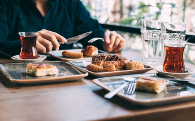 Traditional Turkish breakfast spread featuring simit, açma, and poğaça pastries, offering a delicious assortment of baked goods that capture the essence of Turkish morning flavors and textures.