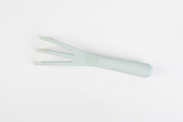 Garden tools with blue grips on a white background