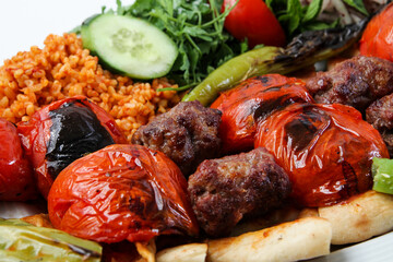 traditional turkish meatball kebab tomato and rice. turkish kebab hot meatball spicy