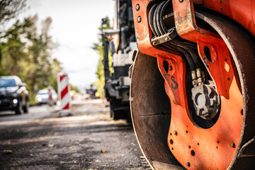 Road roller closeup, asphalt paving, road renovation.	
