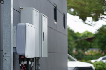 Instalation control of inverters solar panel on the wall. Technology of solar renewable energy