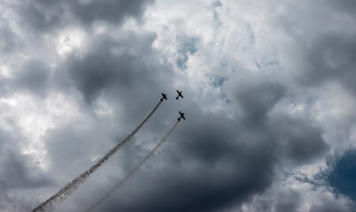 A pilot flies an aerobatic propeller plane in the sky