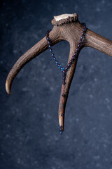 Ottoman Amber Rosary Collection products. Rosary hanging on antlers (focus adjusted)