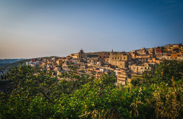 Italy, Sicily, Ragusa District, Monterosso Almo. June 2023. Amazing little houses that grew on top of each other. Evening hour.