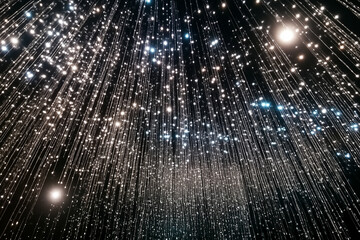 Dark wall covered with many small sparkling lights in various colors that form a pattern like raindrops on glass. Searchlights. Light effect stage for presentation illuminated by spotlights. 