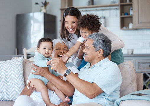 Naklejki Relax, smile and care with family on sofa for bonding, laughing and support. Love, happiness and generations with senior man and woman with child in living room of home for funny and lounge together