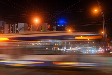 City street view, road, cars and heavy traffic, urban architecture during at night, Chisinau, Moldova