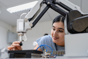 Hispanic engineer woman working on AI technology in robotics electronics engineering laboratory....