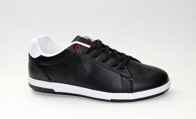 Men's sneakers. White background. Side view Unbranded shoes.
