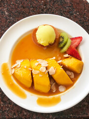 Mango sorbet with fresh mangoes and fruits in sweet tangy sauce