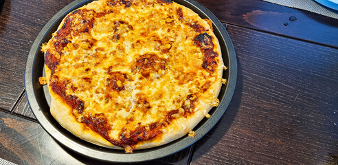 Delicious homemade Italian pizzas are on the table.