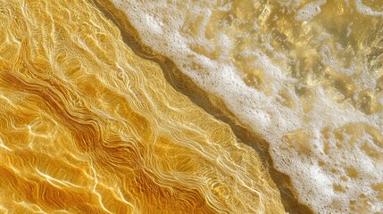 Obraz premium Crystal-clear waves meet golden sands under radiant sunlight on an empty, peaceful shoreline.