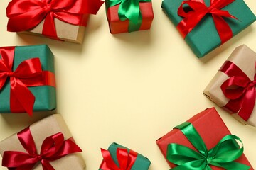 Beautiful gift boxes tied with bows on color background 