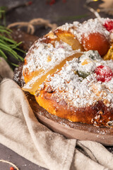 Bolo do Rei or King s Cake, Made for Christmas, Carnavale or Mardi Gras with Christmas season elements in Background.