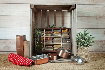 Vintage wooden box with compartments filled with spice packets
