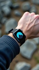 Fototapeta premium Smartwatch on hand displaying mountain icon, perfect for outdoor adventures, hiking, and nature exploration themes.