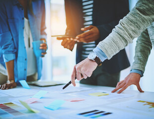 Hands, group discussion and business people pointing at paper for strategy, data or brainstorming....