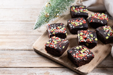 Christmas brownie on wooden table. Copy space
