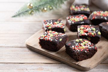 Christmas brownie on wooden table. Copy space