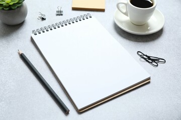 Workplace with notebook, pencil, cup of coffee, top view 