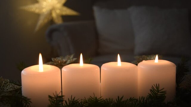 Four Advent candles are burning.