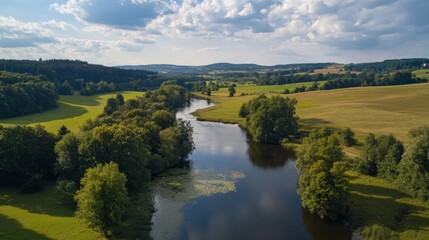 Obraz premium Immerse yourself in Czech history and nature with a summer trip to South Czech, visiting the Castle of Blatná, surrounded by a fallow deer park, and nestled amidst the scenic Lomice River.