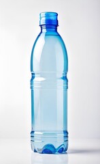 Naklejka premium Empty, transparent plastic water bottle with a light blue tint stands against a plain white background, capturing reflections elegantly. AI generated. 