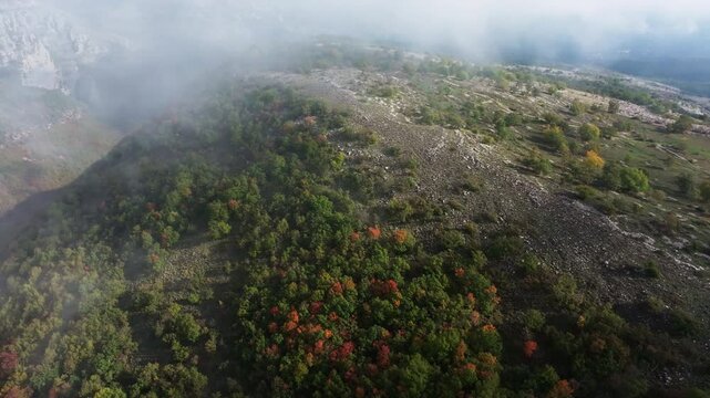 Drone flighting in clouds over Col de Vence in Provence