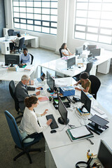 Above, computer and team with business people in office for research, company revenue and auditor. Planning, online and collaboration with group of employees in digital agency for finance report