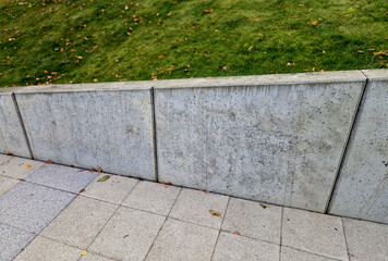 ugly holding a road notch of a bridge forecourt tunnel. retaining wall with concrete grouting is covered with fake, optically prettier wall. fencing with hollow bricks filled with wires, railing,steel