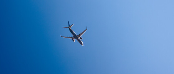 flying plane against the blue sky